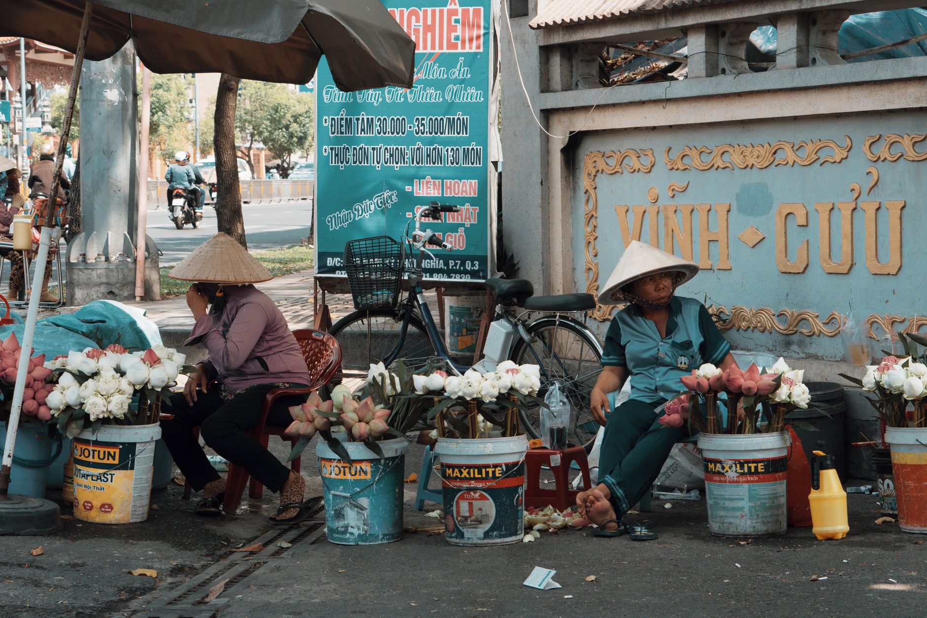 Urban street market with flower vendors and local culture in action.