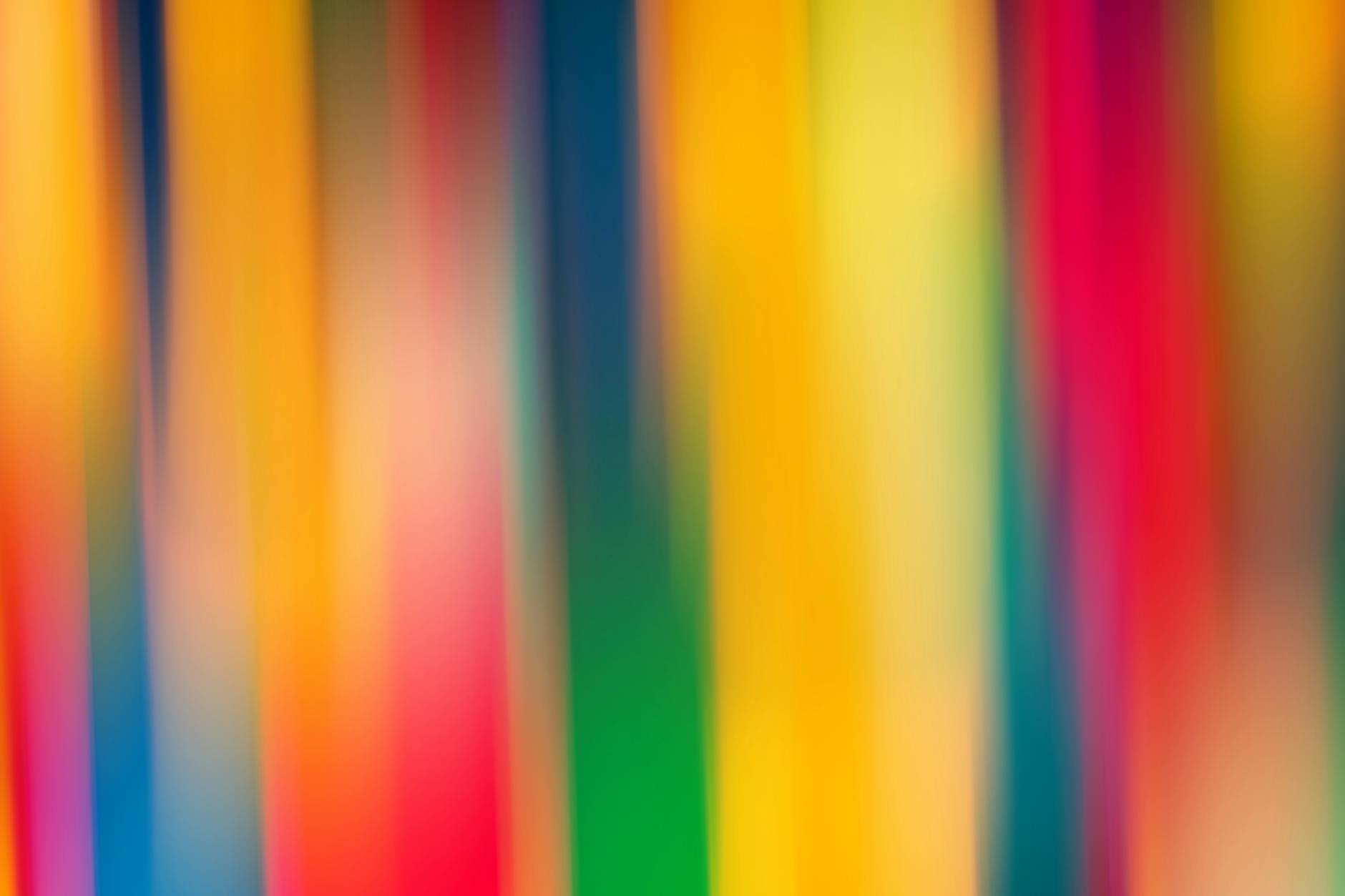 A vibrant abstract image featuring colorful blurred stripes creating a dynamic visual effect.