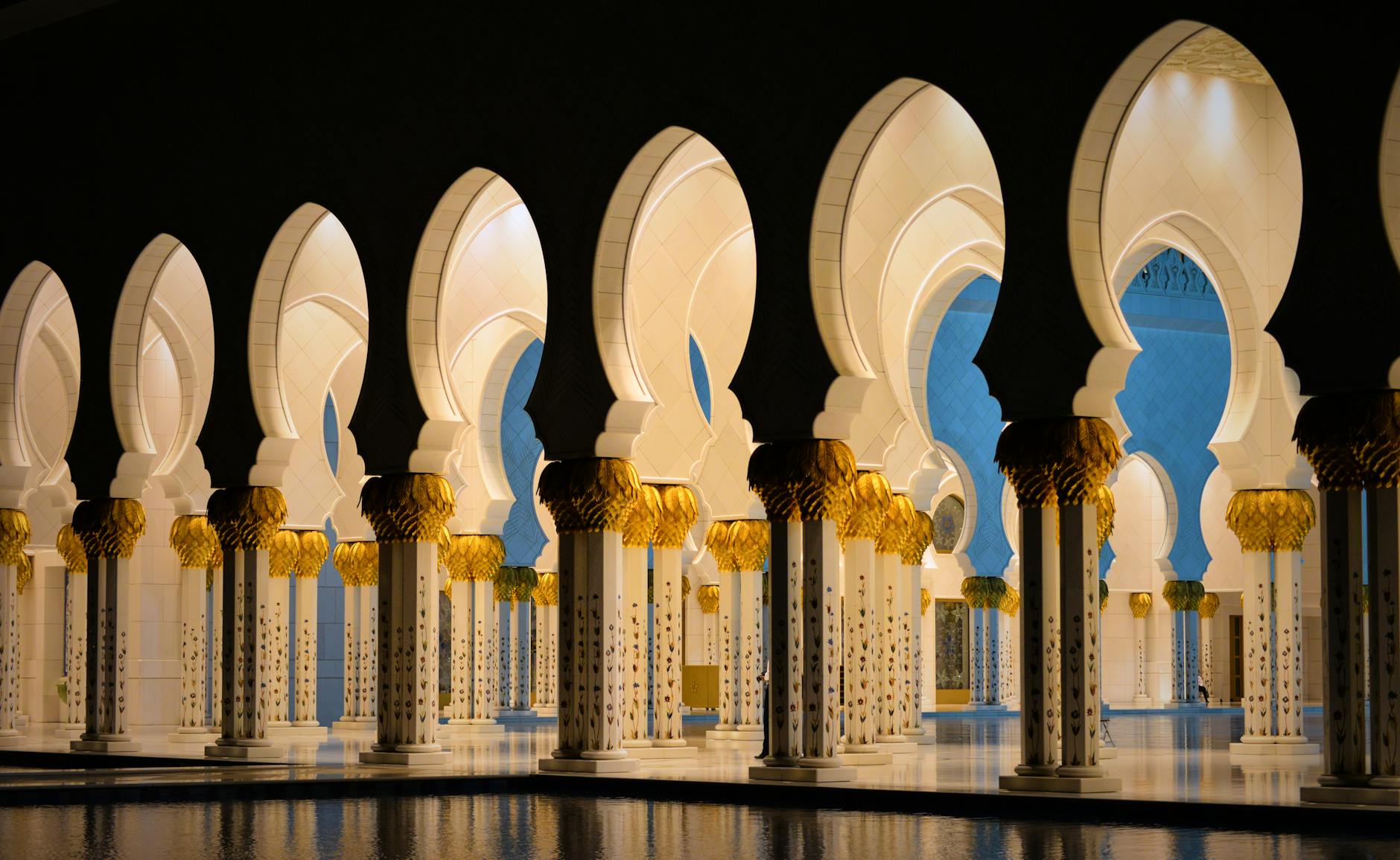 Dramatic view of illuminated arches at Sheikh Zayed Grand Mosque, Abu Dhabi.