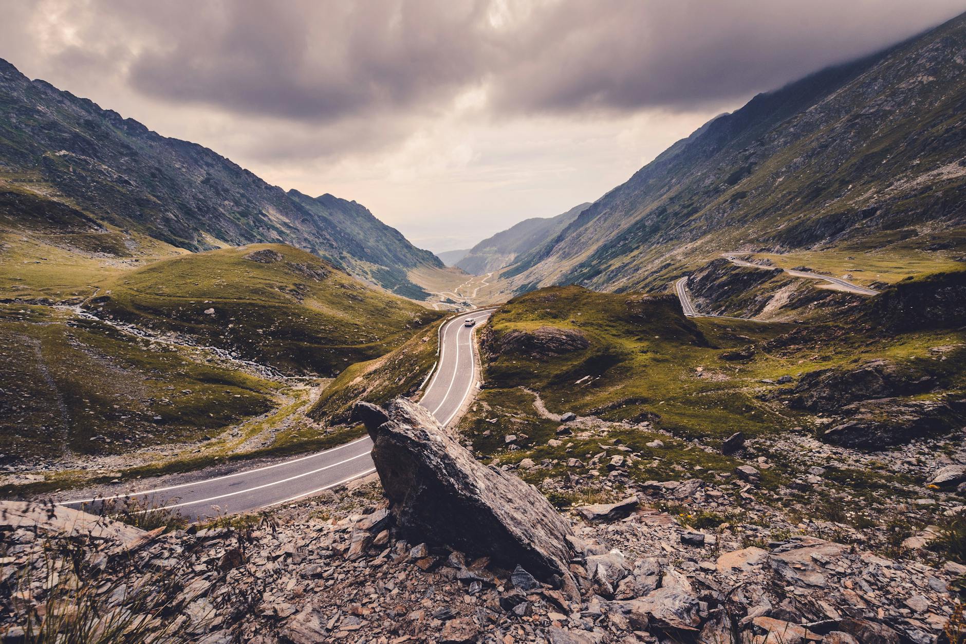 Scenic view of a winding road in the Fagaras Mountains, Romania.