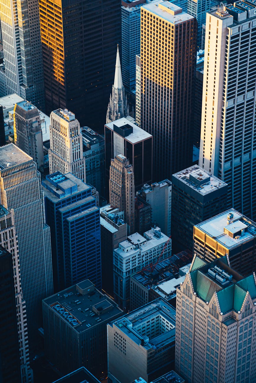Dramatic aerial view of Chicago's iconic skyscrapers at twilight, showcasing urban architecture.