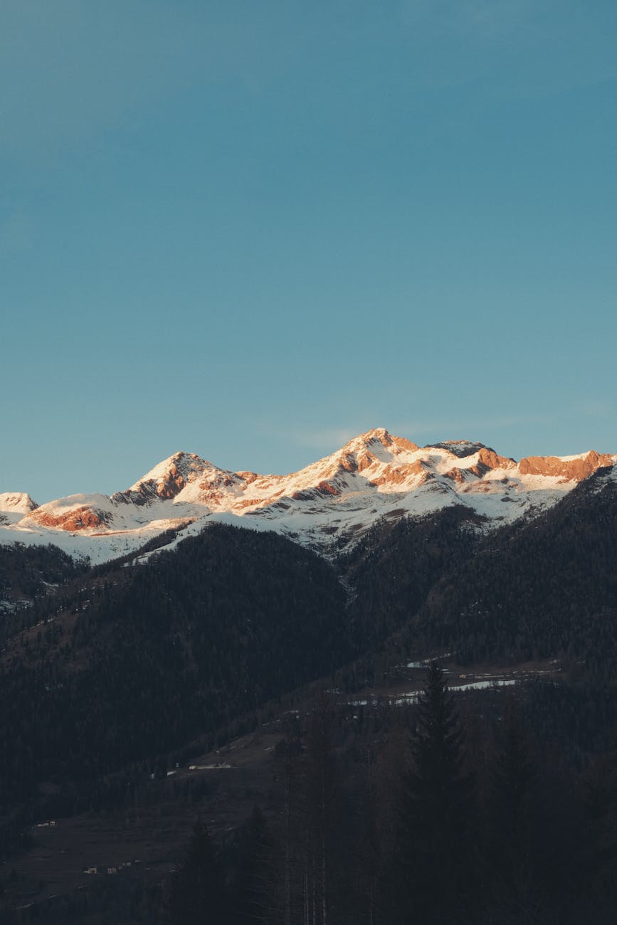 Beautiful sunset over snow capped Dolomites in Trentino-Alto Adige, perfect landscape wallpaper.