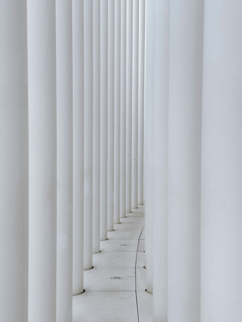Symmetrical white columns forming a modern architectural detail in Luxembourg.
