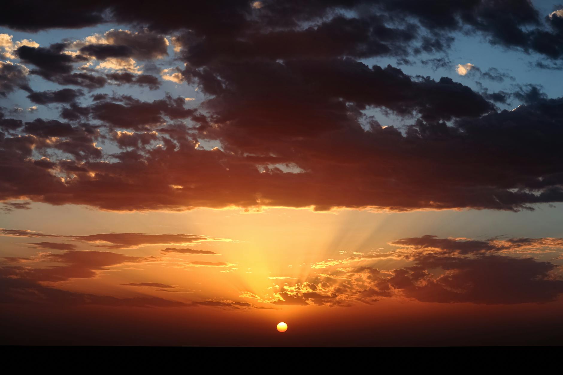 Stunning sunset with vibrant colors over Timokten in Adrar Province, Algeria.