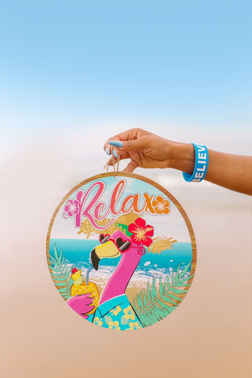 Colorful flamingo sign reads 'Relax', perfect for adding a tropical vibe or summer decor.
