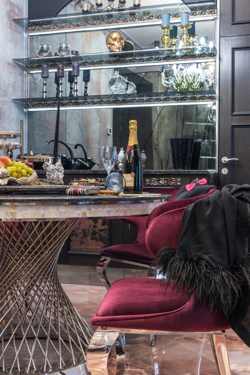 Opulent dining area with velvet chairs and decorative table setting, perfect for luxury interiors.