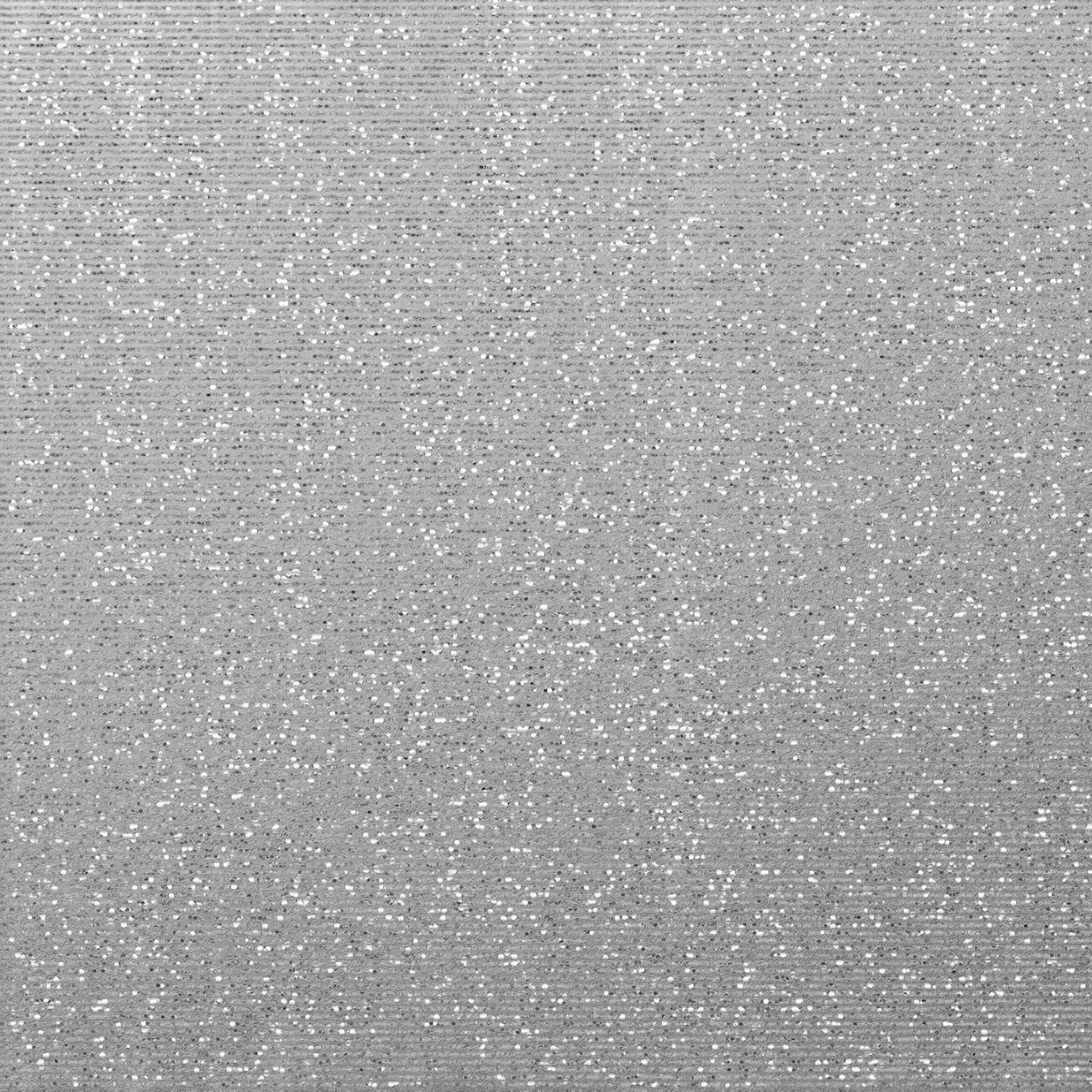 A black and white image depicting a textured and patterned wall surface.