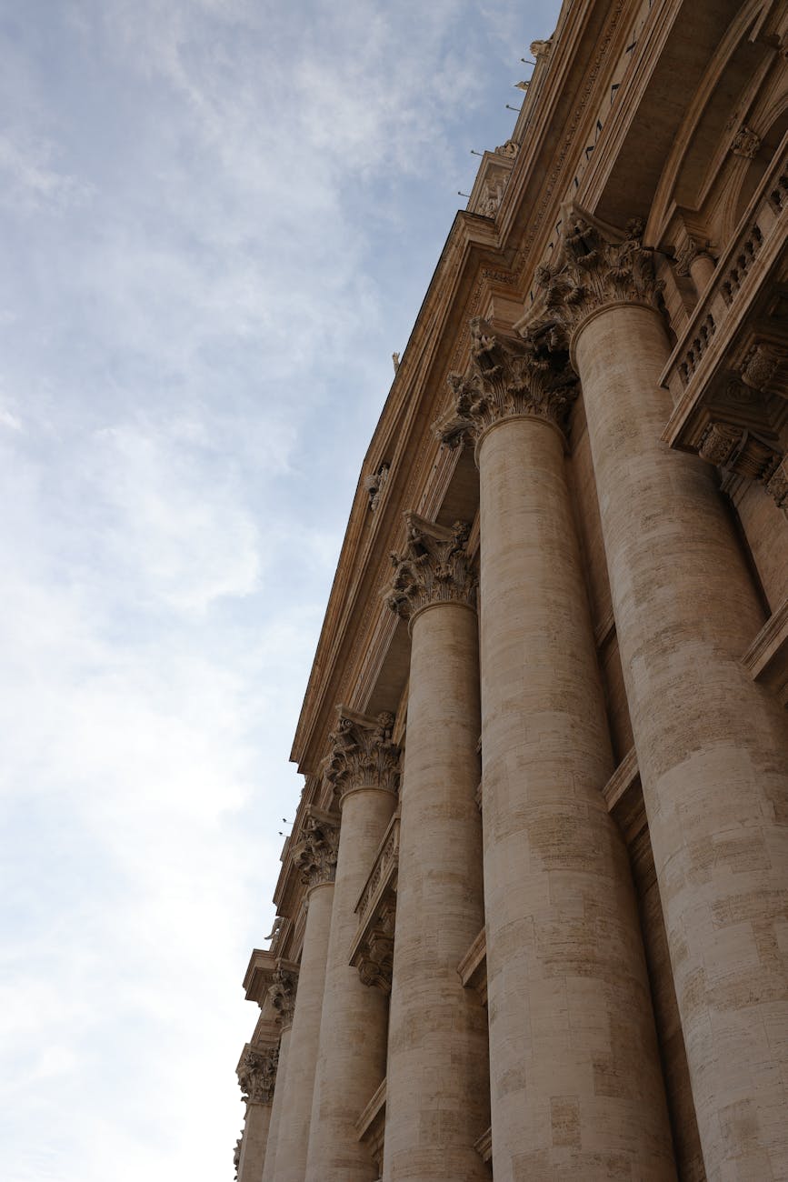 Majestic view of historic classical columns in Rome, symbolizing European architectural heritage.