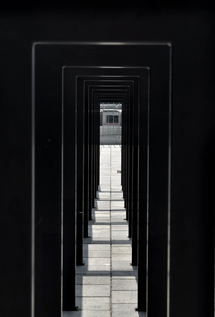 Explore the symmetry of a modern urban passageway with strong geometric lines and minimalist design.