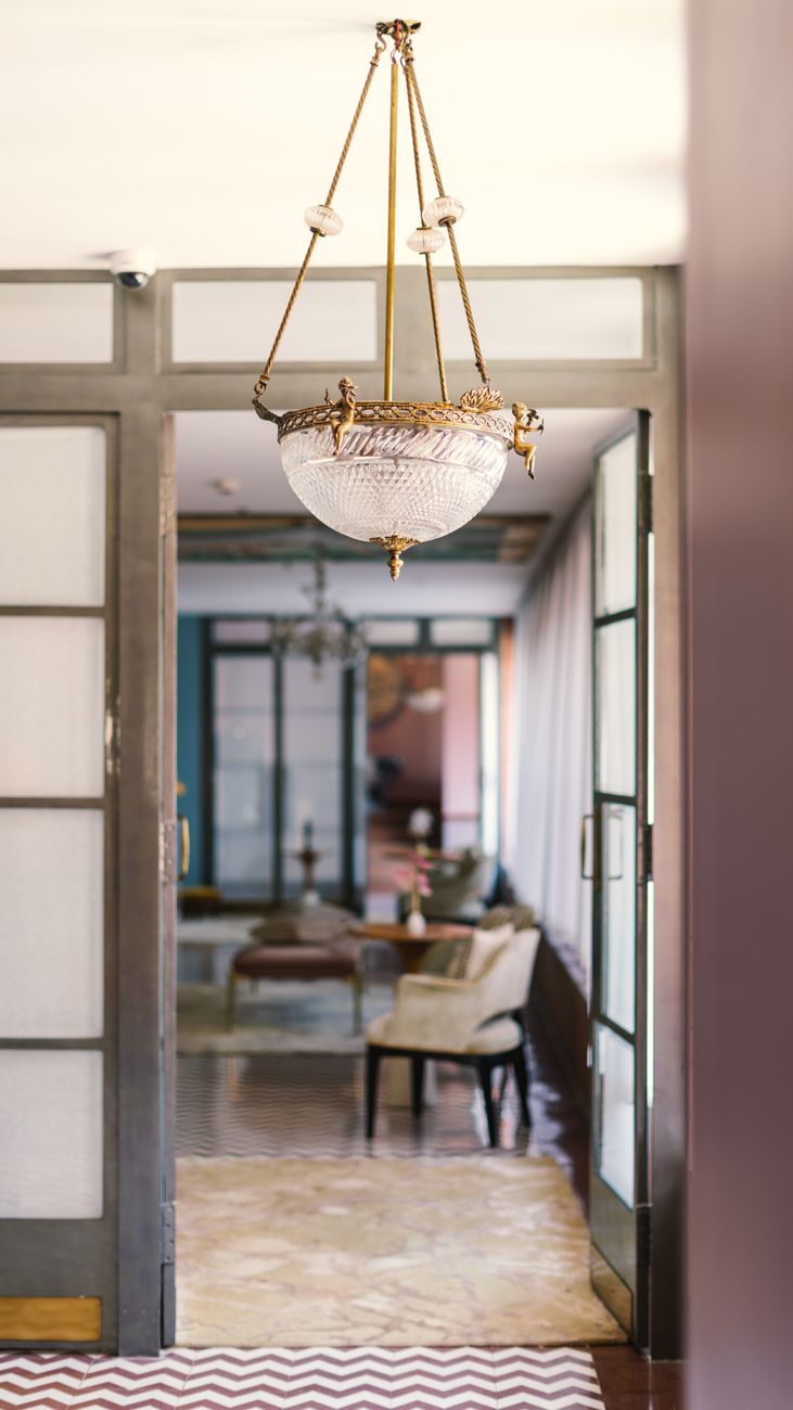 Sophisticated interior shot of a heritage hotel dining room in Bikaner, Rajasthan, showcasing luxury decor.