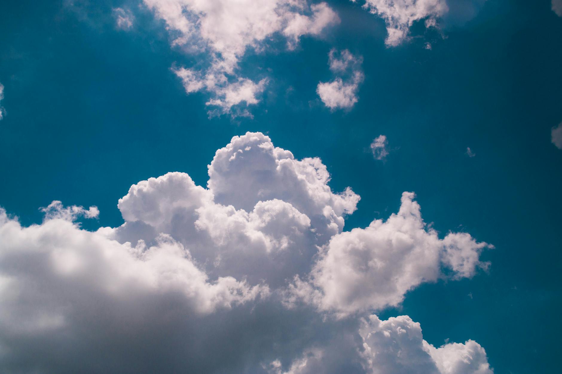 Beautiful fluffy clouds against a vibrant blue sky in Bahia, Brazil, showcasing nature's drama.