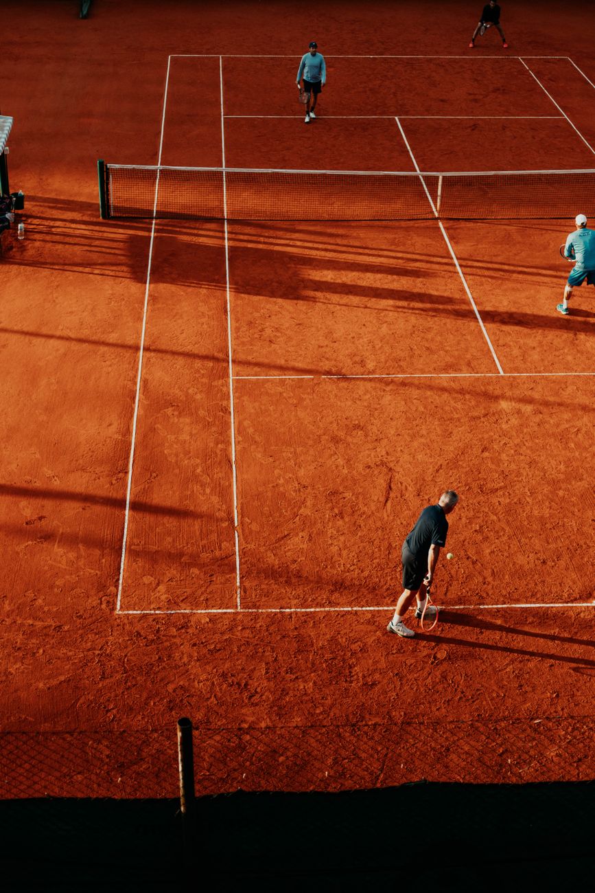 Tennis players competing on a clay court in Buenos Aires, Argentina.