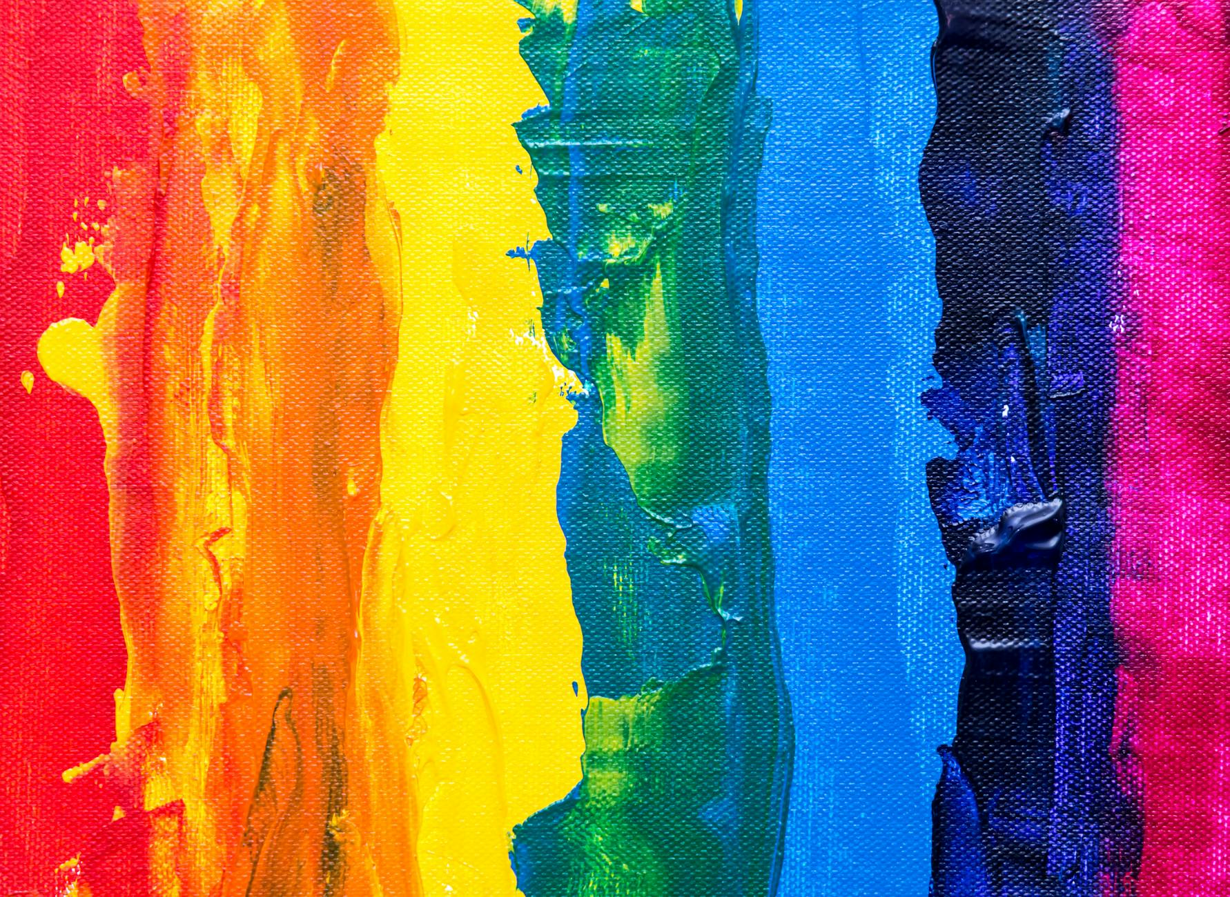 Colorful abstract rainbow painting with textured acrylic on canvas, showcasing vibrant hues.